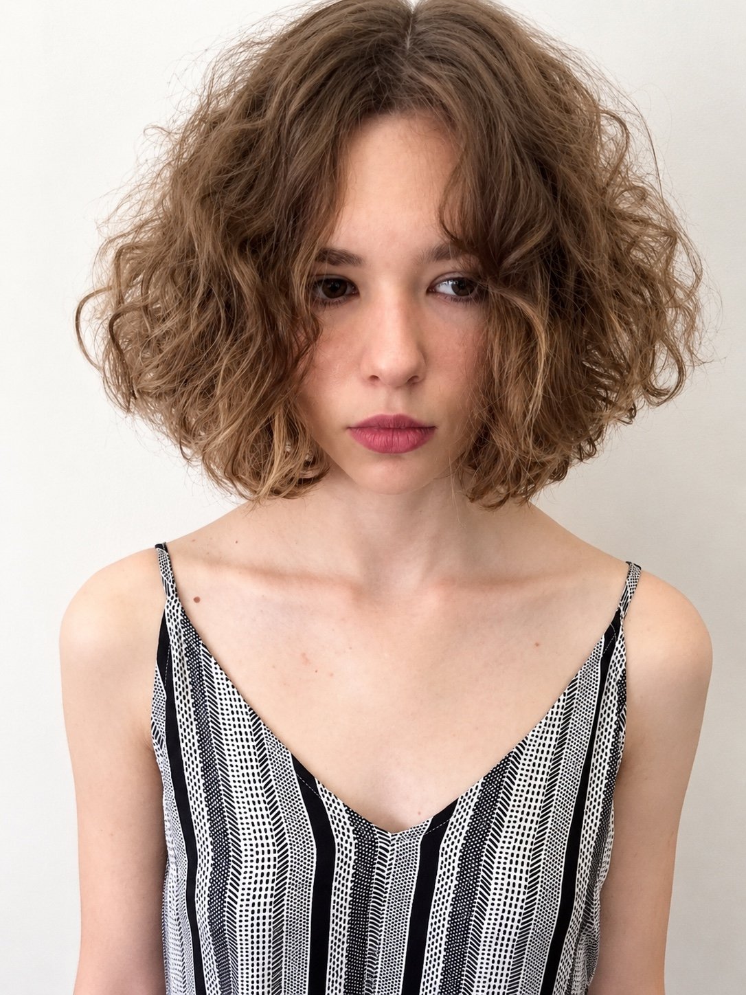 Curly bob haircut by Andrii Gerashchenko