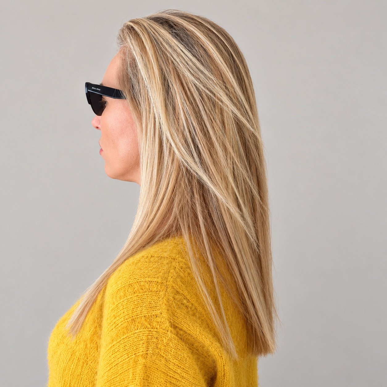Long layered blonde haircut by Andrii Gerashchenko